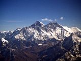 Kathmandu Mountain Flight 08-1 Everest, Nuptse, Lhotse, Ama Dablam 1997 The highlight of the Kathmandu Mountain Flight is when Everest comes into view, poking its head above the Nuptse Lhotse south face. The peak in the middle right is Ama Dablam, one of the most beautiful peaks in the world.